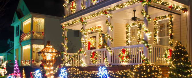 Festively decorated house with holiday lights powered by solar energy, showcasing District Energy LLC's energy-saving solutions.